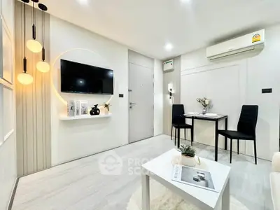 Modern living room with stylish decor and sleek furniture, featuring a wall-mounted TV and ambient lighting.