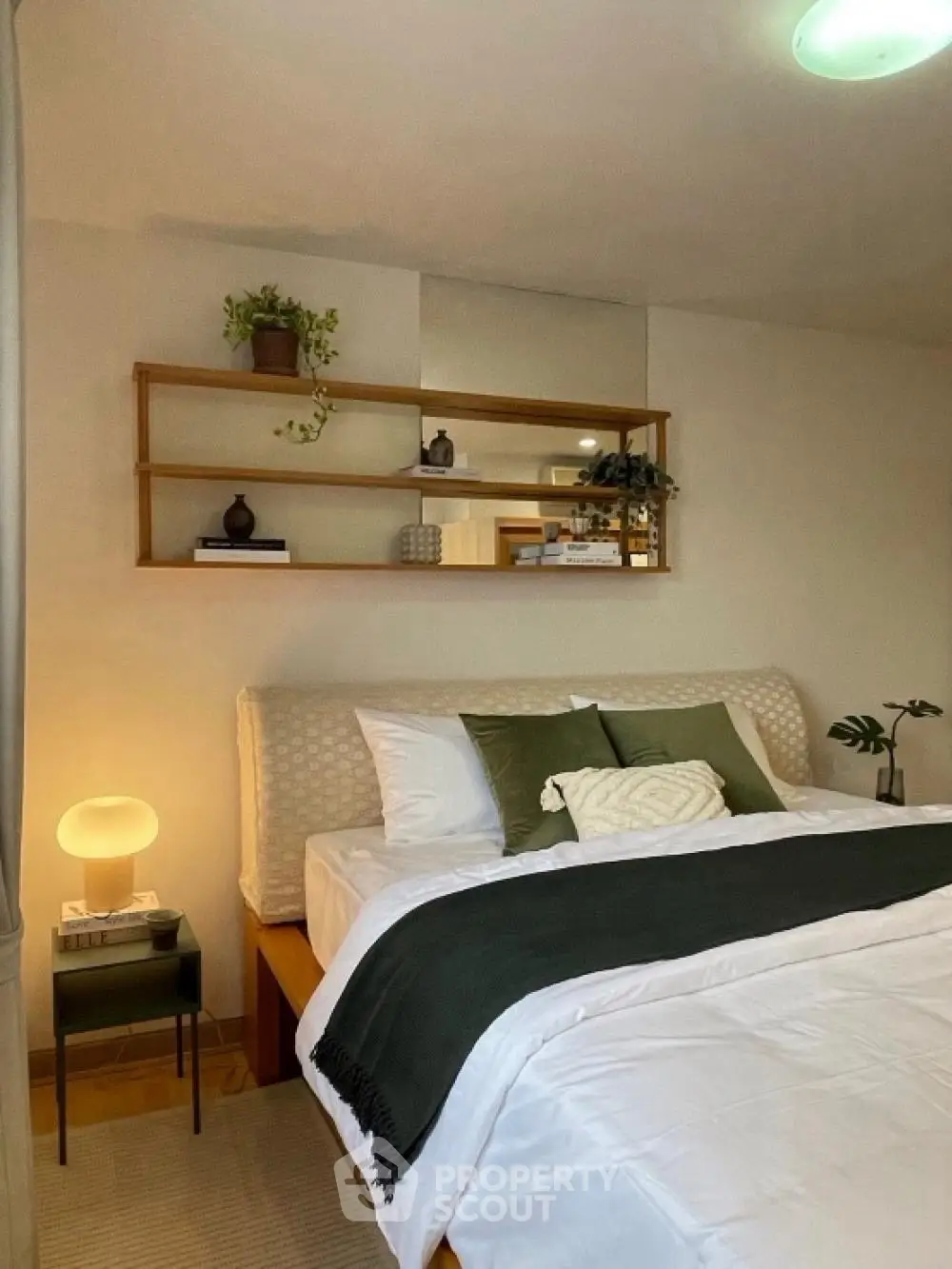 Cozy bedroom with stylish decor and elegant lighting