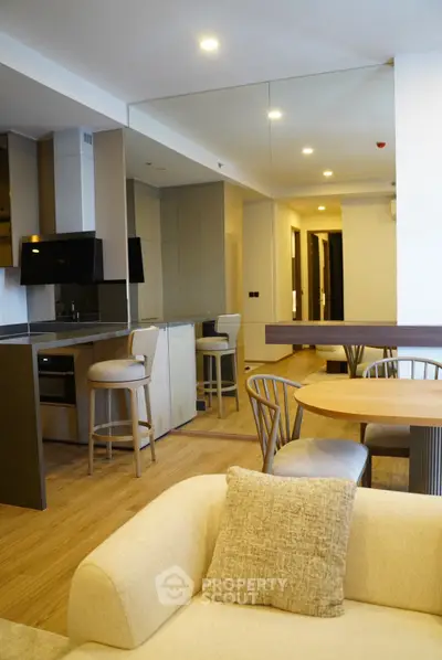 Modern open-plan living room with stylish kitchen and dining area