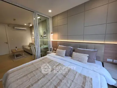Modern bedroom with stylish decor and cozy ambiance in a contemporary apartment.