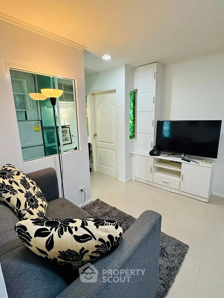 Cozy living room with modern decor and entertainment setup