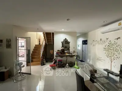 Spacious living room with modern decor and staircase in a bright home