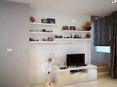 Stylish living room with modern decor and entertainment center