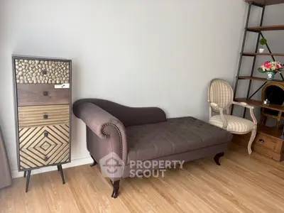 Stylish living room with elegant chaise lounge and decorative cabinet