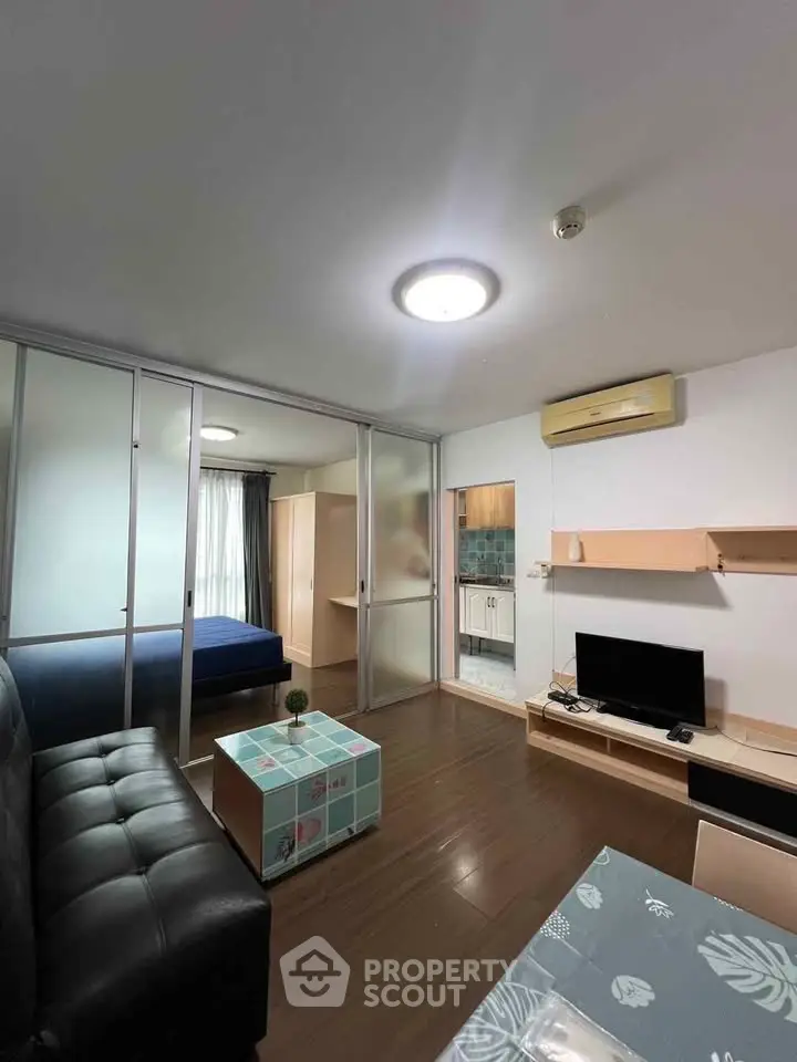 Modern studio apartment with open layout, featuring a cozy living area and stylish decor.
