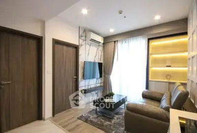 Modern living room with sleek design, featuring a leather sofa, wall-mounted TV, and stylish shelving.