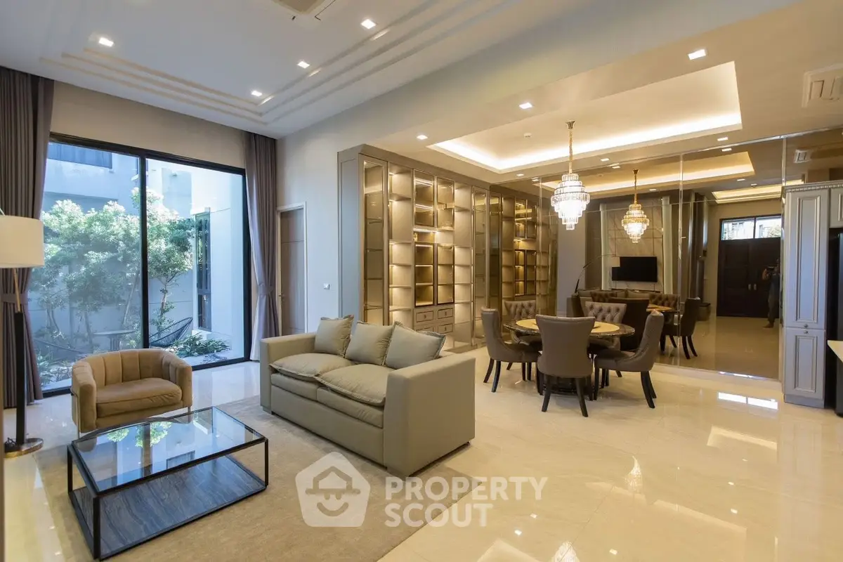Luxurious open-plan living room with elegant dining area and modern decor