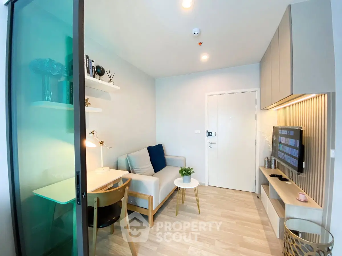 Modern compact living room with stylish decor and natural light