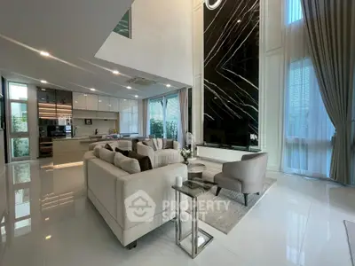 Luxurious modern living room with high ceilings and elegant decor
