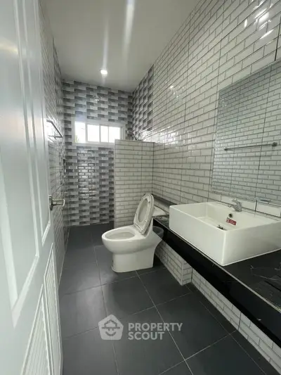 Modern bathroom with sleek tiles and contemporary fixtures