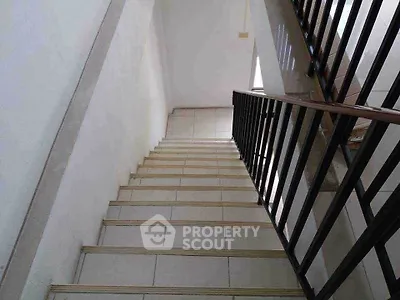 Modern staircase with sleek railing in a contemporary building