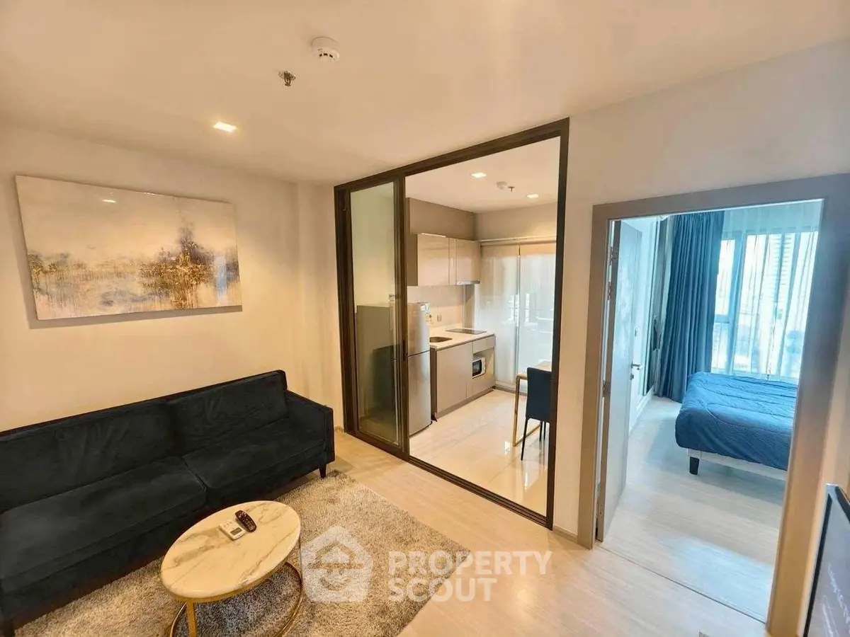 Modern apartment interior with cozy living room, compact kitchen, and inviting bedroom.