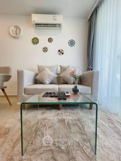 Modern living room with stylish decor and glass coffee table