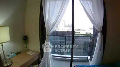 Modern bedroom with balcony view in urban apartment