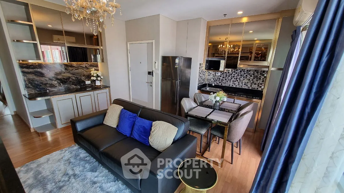 Luxurious modern living room with elegant decor and open kitchen layout, featuring plush seating and stylish dining area.