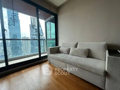Modern living room with city view and cozy sofa in high-rise apartment
