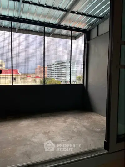 Spacious balcony with city view, ideal for relaxation and outdoor activities.