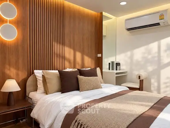 Modern bedroom with stylish wood paneling and cozy lighting