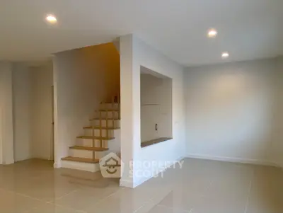 Modern minimalist interior with staircase and open space design