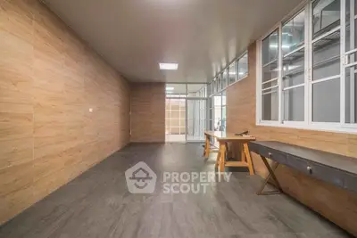 Spacious modern office space with wooden accents and ample natural light.