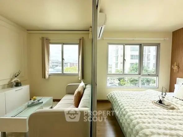 Modern apartment interior with cozy living room and bright bedroom, featuring large windows and stylish decor.