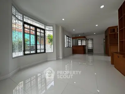 Spacious modern living room with large windows and open layout