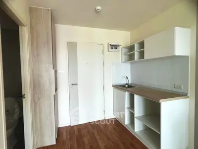Modern minimalist kitchen with open shelving and wood flooring