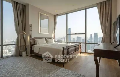Luxurious bedroom with panoramic city view and elegant furnishings