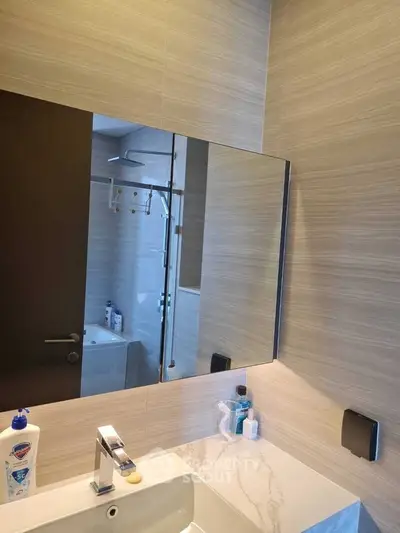Modern bathroom with sleek fixtures and stylish mirror design