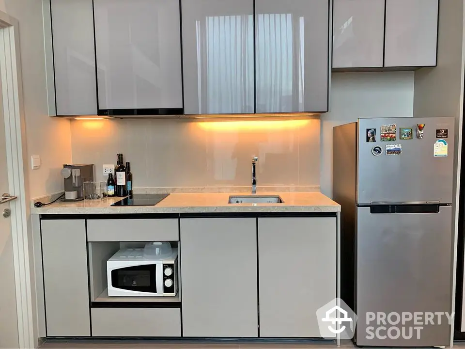 Modern kitchen with sleek cabinetry and stainless steel appliances