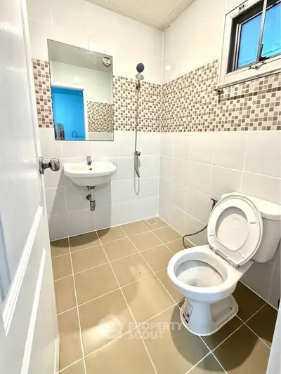 Modern bathroom with sleek tiles and contemporary fixtures