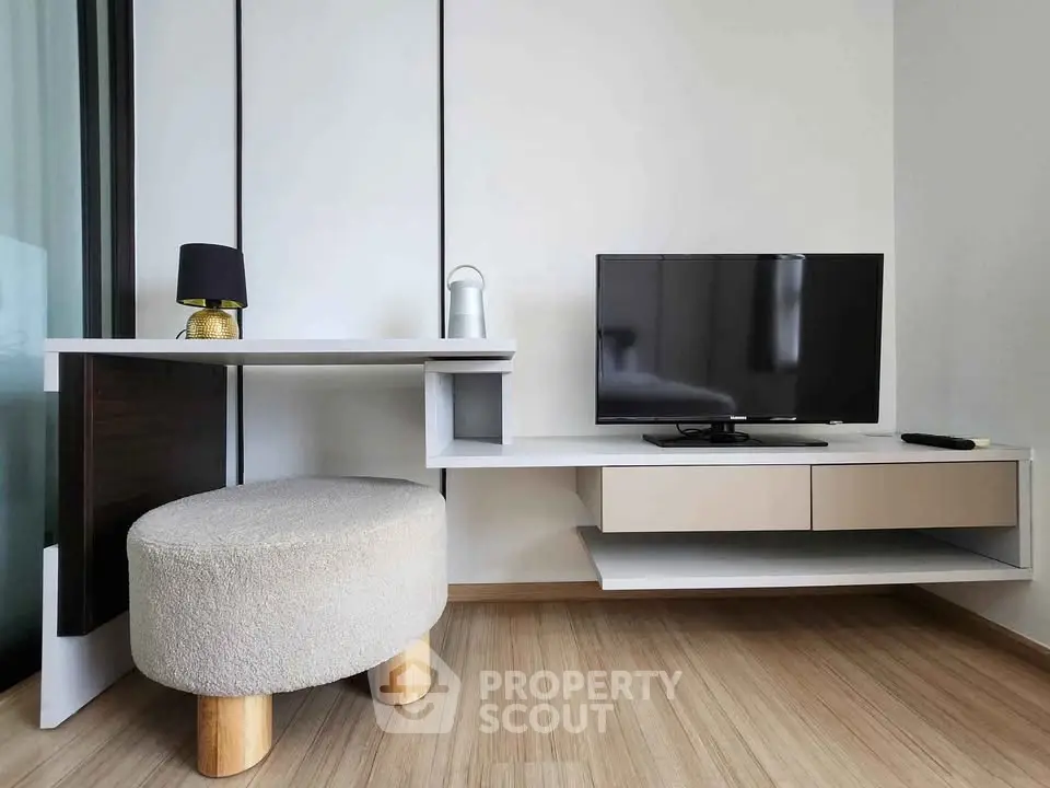 Modern living room with stylish TV stand and cozy seating area