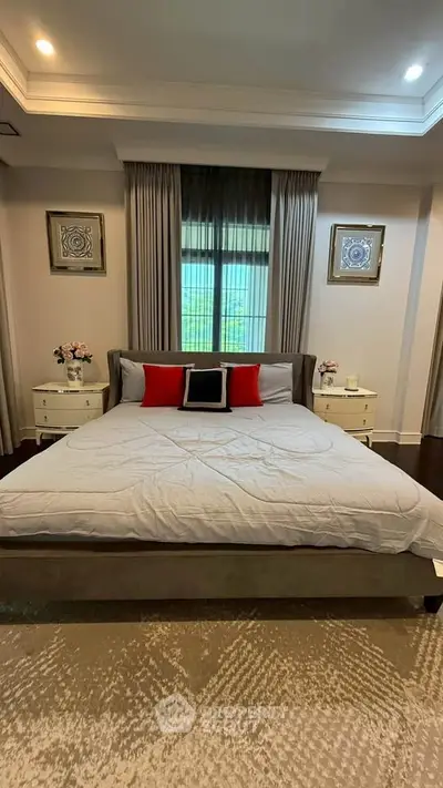 Luxurious bedroom with elegant decor and large window view