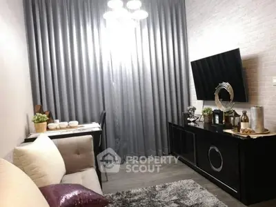 Modern living room with sleek decor and wall-mounted TV