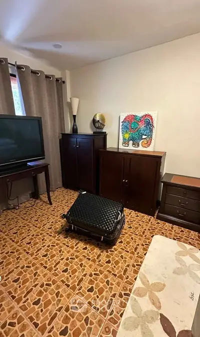 Cozy living room with unique tiled floor and modern decor