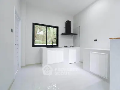 Sleek modern kitchen with minimalist design and large window view