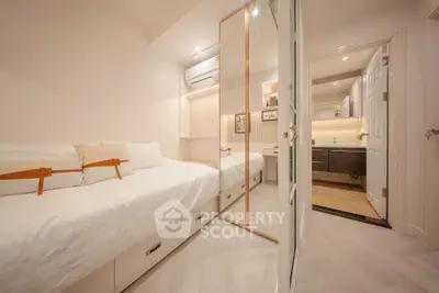 Chic and cozy bedroom with mirrored closet and modern decor