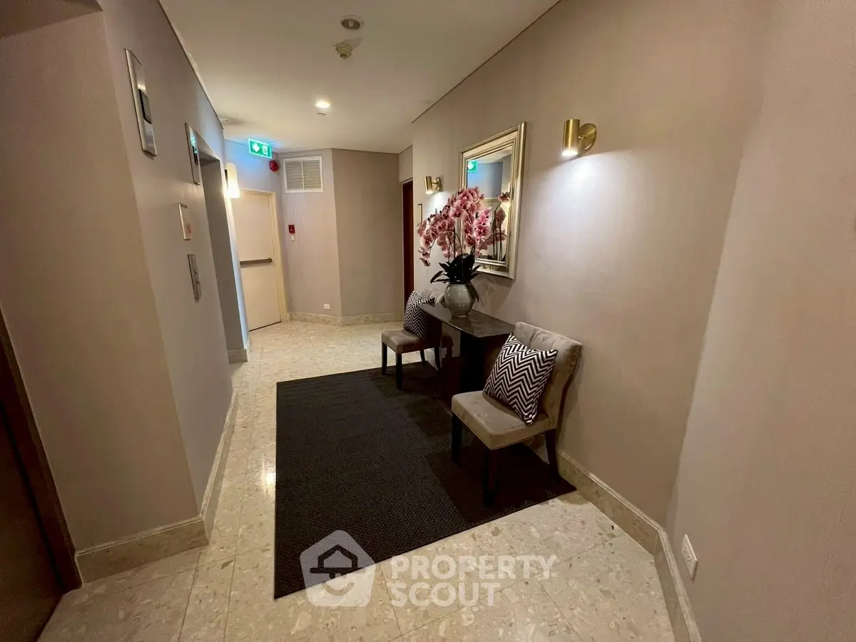 Elegant hallway with stylish decor and seating in a modern building