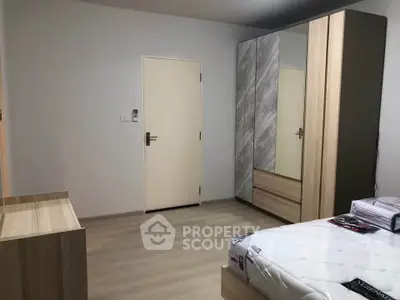 Spacious bedroom with modern wardrobe and minimalist design