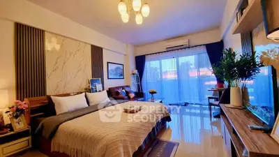 Luxurious bedroom with modern decor and large window offering natural light