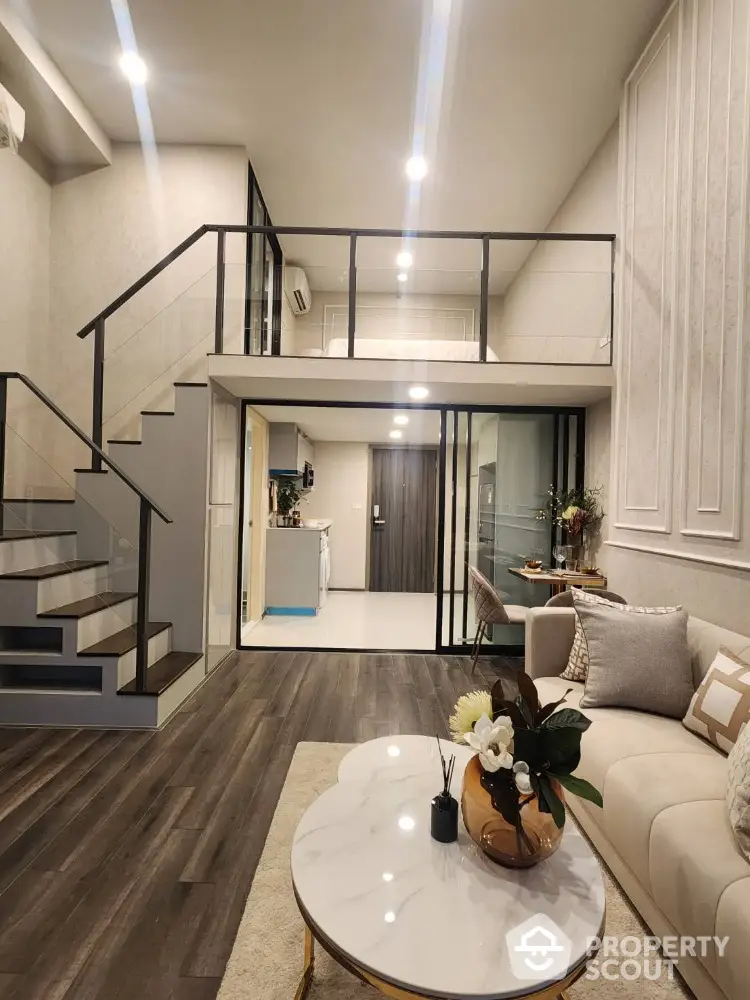 Modern duplex living room with stylish decor and mezzanine level