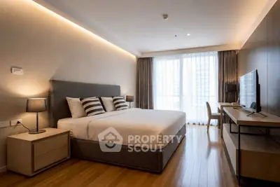Modern bedroom with stylish decor and large window in luxury apartment