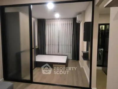 Modern apartment interior with sliding glass doors and minimalist design
