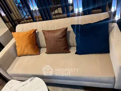 Stylish modern living room with elegant sofa and colorful cushions