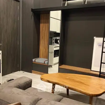 Modern living room with sleek furniture and stylish wooden accents