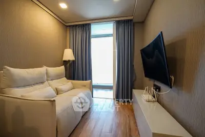 Cozy living room with modern decor and wall-mounted TV