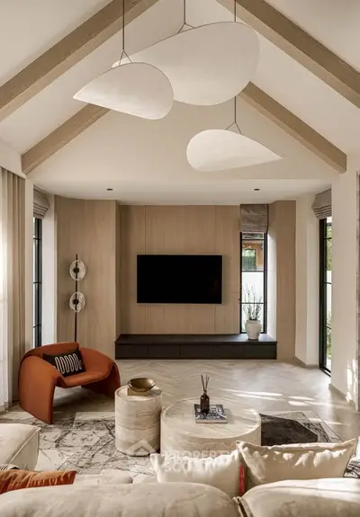 Luxurious living room with modern decor and vaulted ceiling