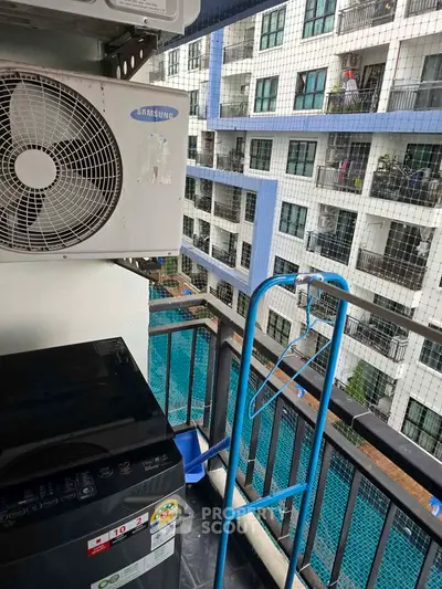 Condo balcony with pool view and air conditioning unit, perfect for urban living.