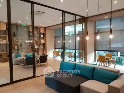 Modern living room with stylish furniture and large windows in a contemporary apartment.