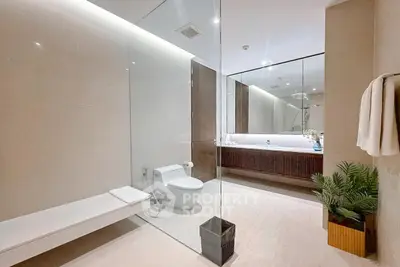 Luxurious modern bathroom with glass shower and elegant fixtures